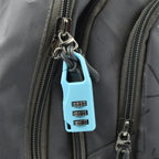 The small 3-digit lock open, showing its internal mechanism.