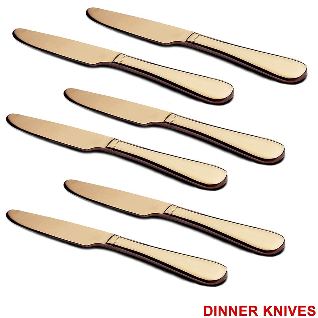 Top-down view of a single gold dinner knife and spoon.