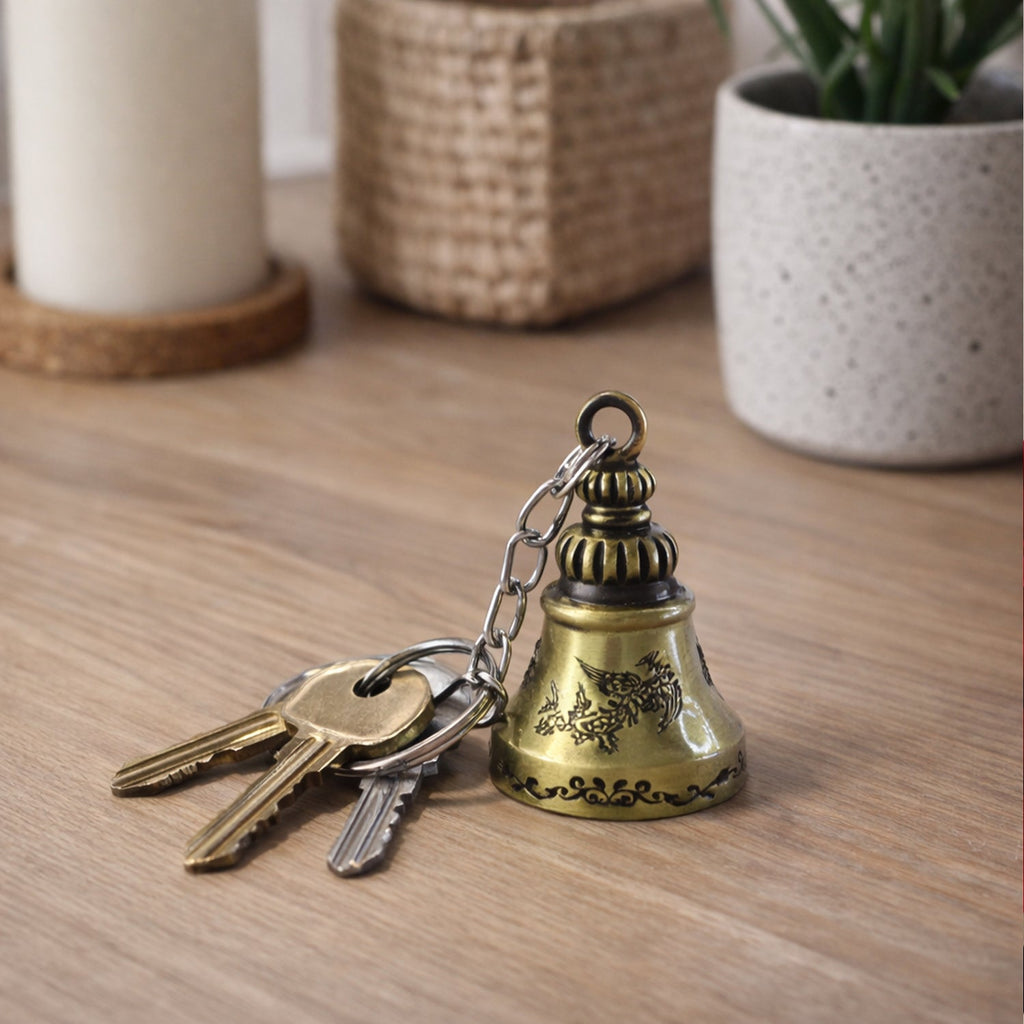 Close-up detail of ringing temple bell on metal keychain