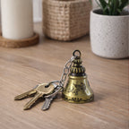 Close-up detail of ringing temple bell on metal keychain