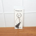 Detailed Hanuman Ji sitting pose devotional metal keychain close-up