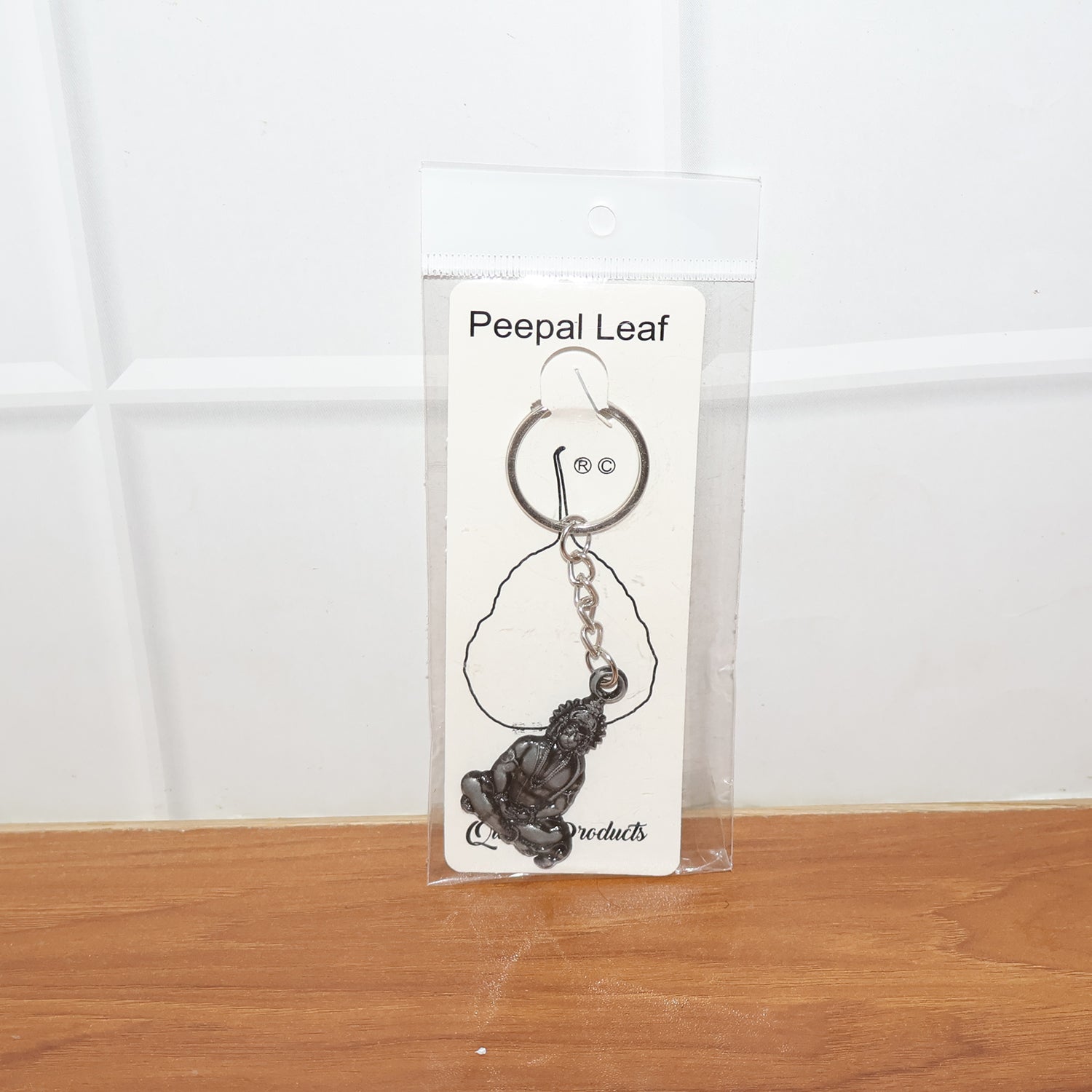 Detailed Hanuman Ji sitting pose devotional metal keychain close-up