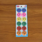 Multicolored smiley face magnetic buttons arranged in set