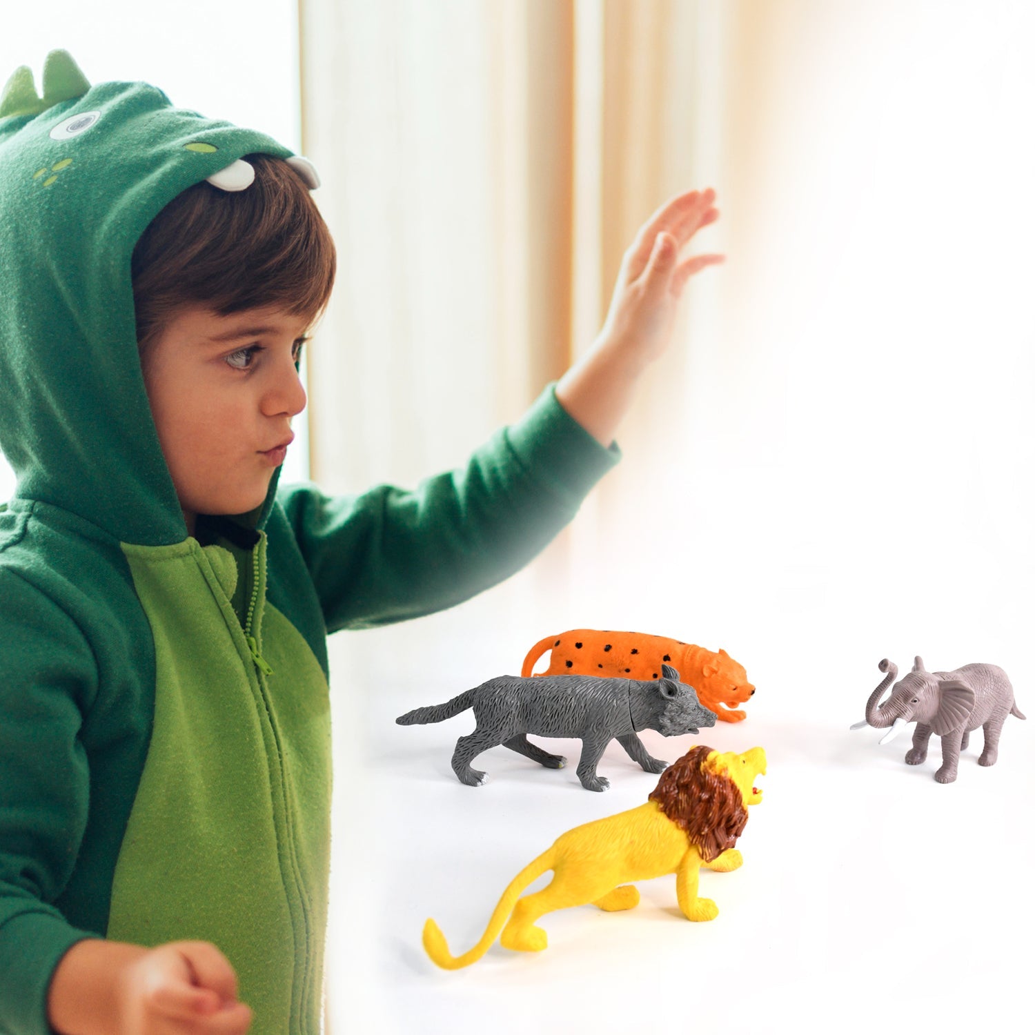 Toy set showing jungle trees and fencing accessories paired with wild animal toys for kids