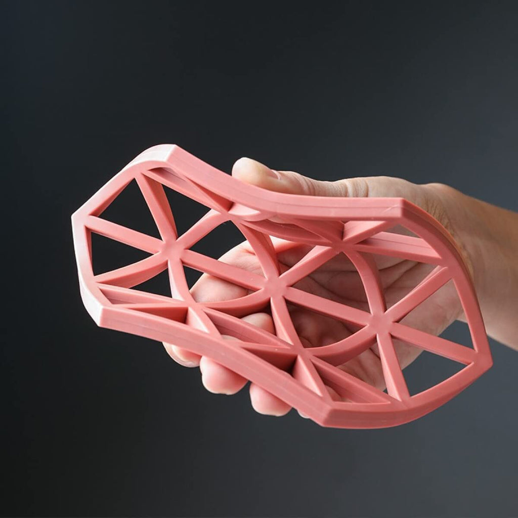 Non-slip PVC pot mat with a hollow design, ideal for high heat resistance.