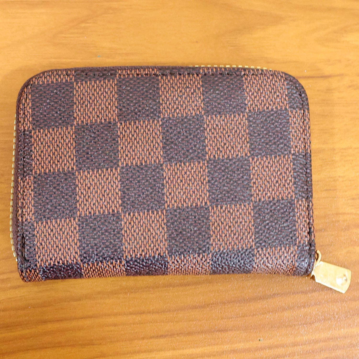 Side angle of zip card holder wallet showing design