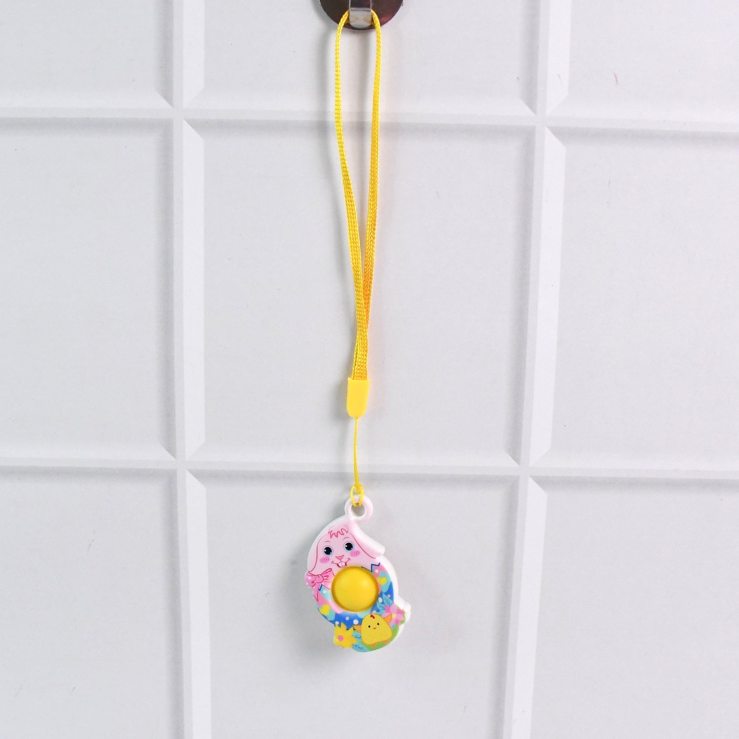 Compact chick-shaped fidget toy shown from side profile