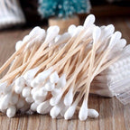 Natural bamboo cotton swabs with strong wooden handles.