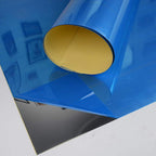 3D mirror tiles enhancing a TV backdrop with a stylish, reflective effect.