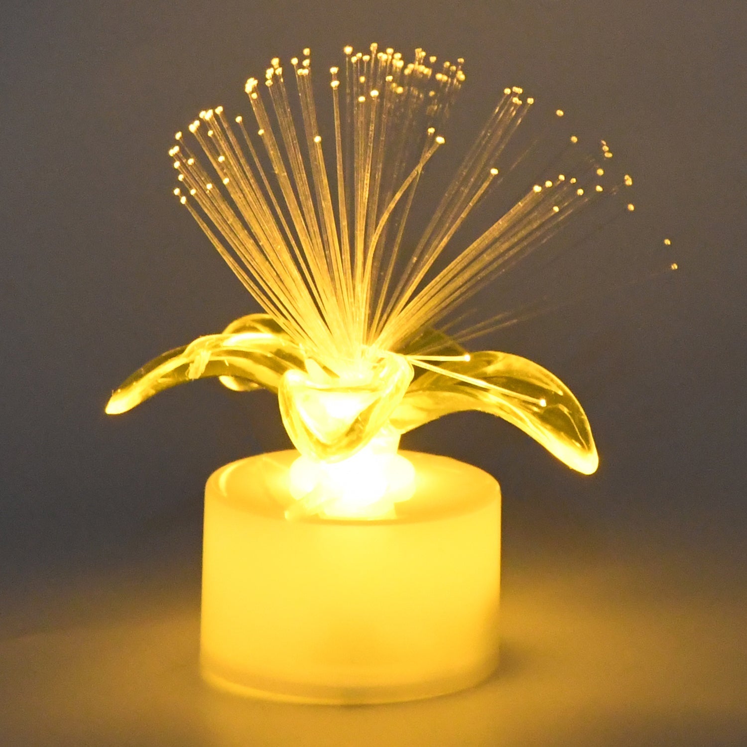 Fiber optic LED centerpieces arranged on a table, creating a festive ambiance.
