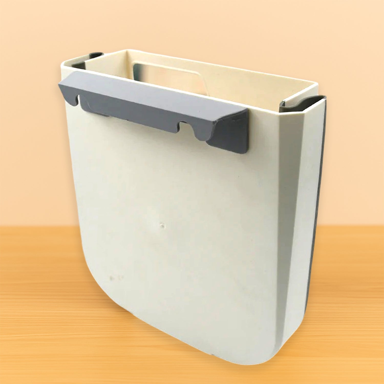 Compact hanging trash can installed in a car, keeping the interior tidy.