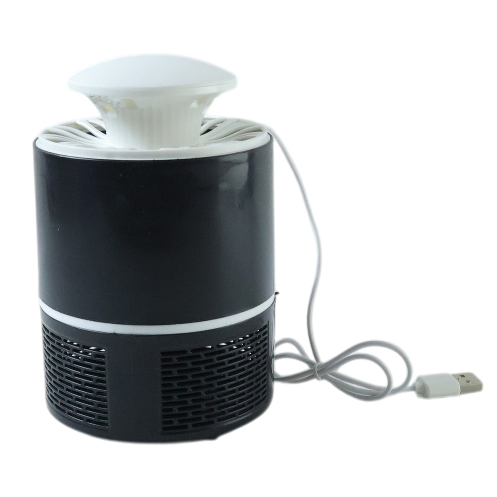 Unplugged mosquito trap device on table demonstrating compact design