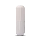 Open capsule travel storage bottle revealing ample space for small items.