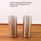 Sleek stainless steel salt and pepper dispensers with twist-off lids