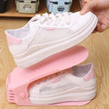 A multi-color adjustable shoe organizer neatly stacking a pair of sneakers.