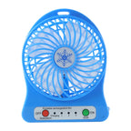 Compact rechargeable mini table fan placed on a desk for workspace cooling