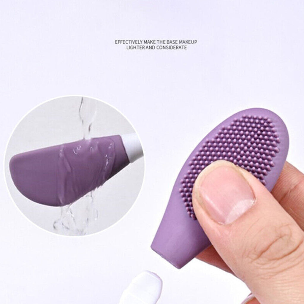 A hand gently scrubbing the face with the textured side of the silicone facial cleansing brush.