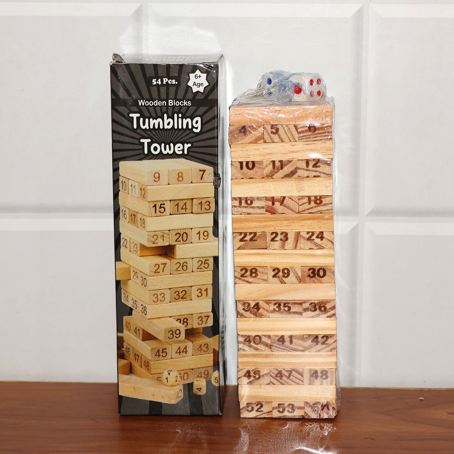 Players carefully removing wooden blocks during Tumbling Tower game