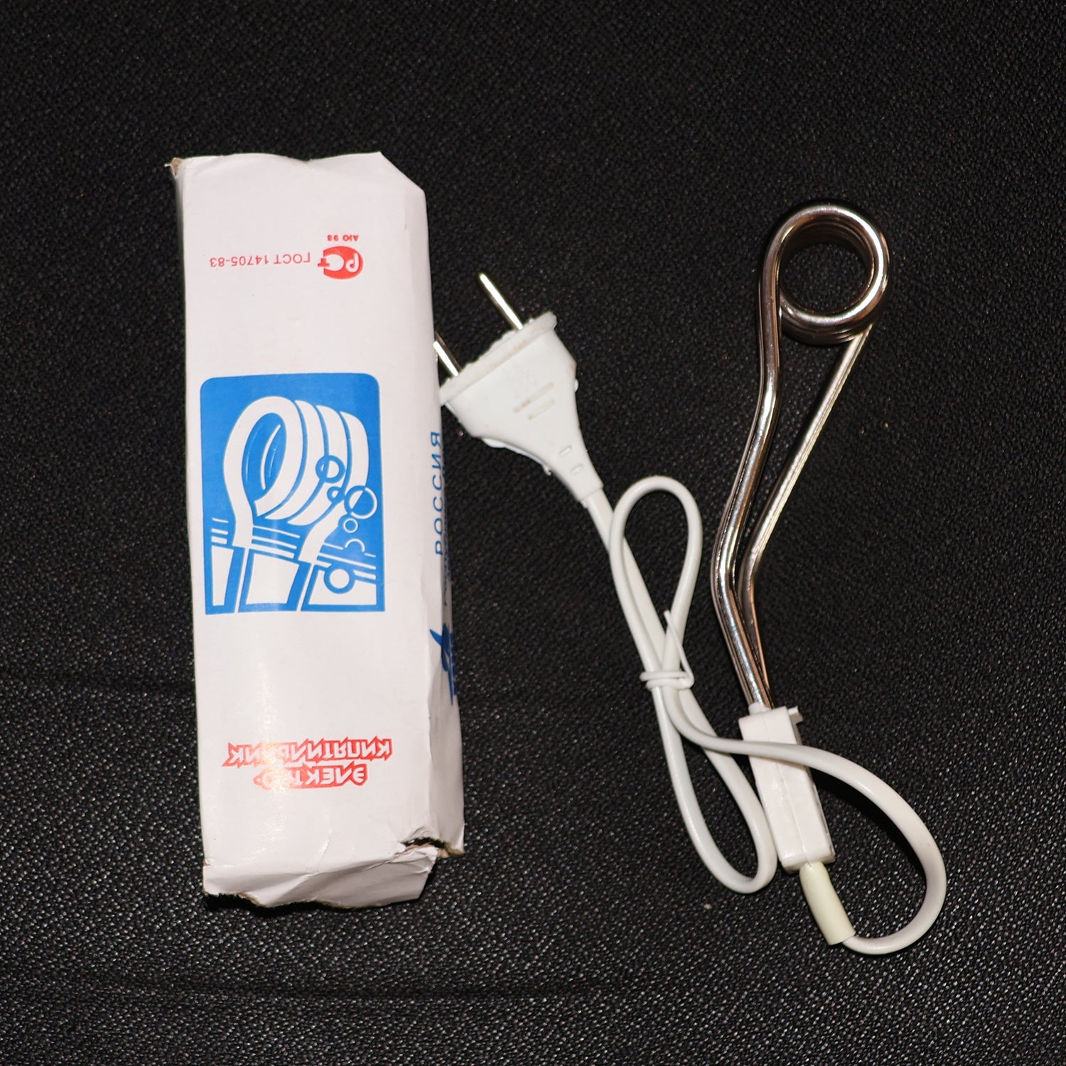 Fast heating immersion rod being used to quickly warm water for a bath