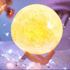 The 3D moon lamp glowing softly on its stand, illustrating adjustable brightness.