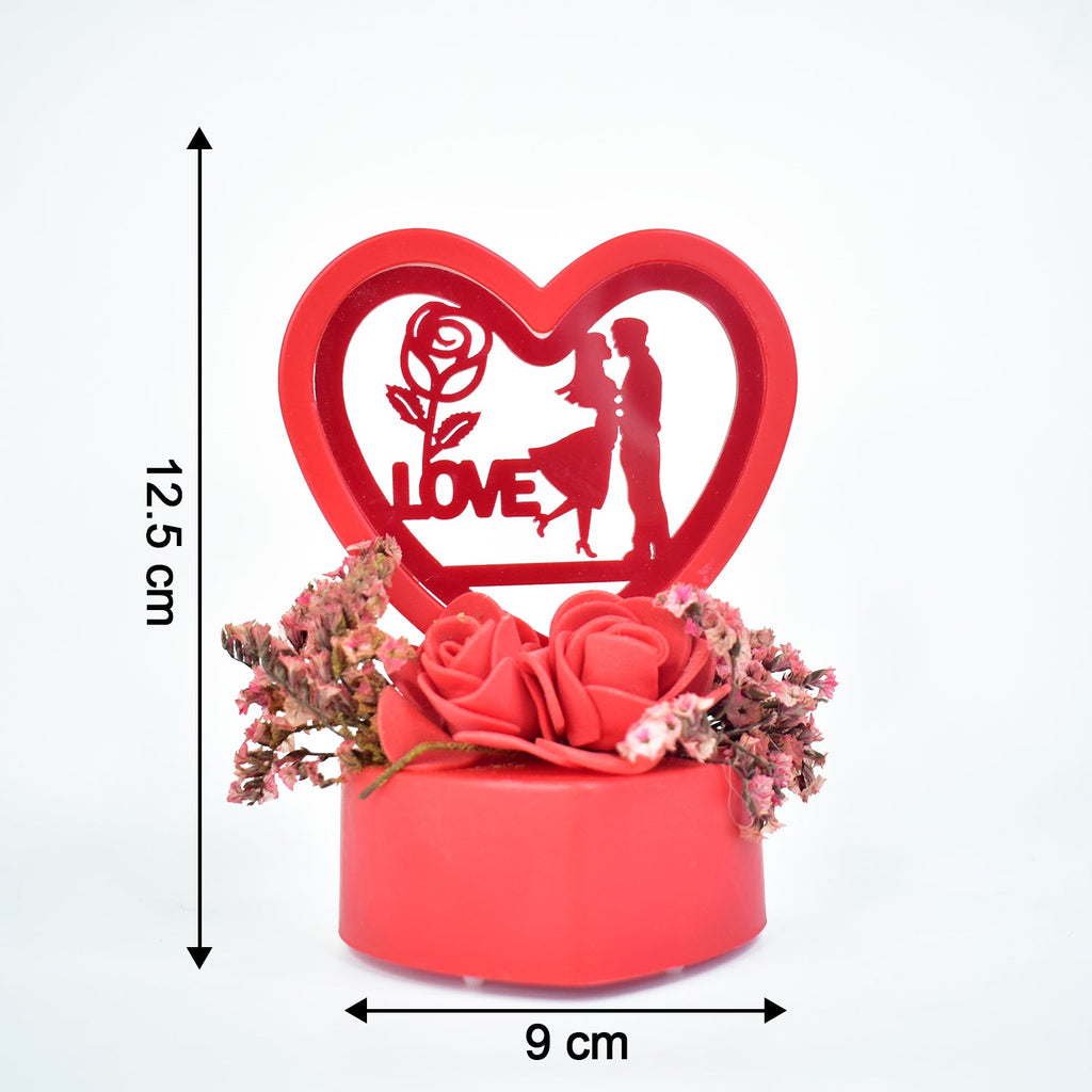 Heart-shaped love couple decor with glowing light and roses base