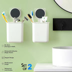 Adhesive bathroom organizer cups installed on wall