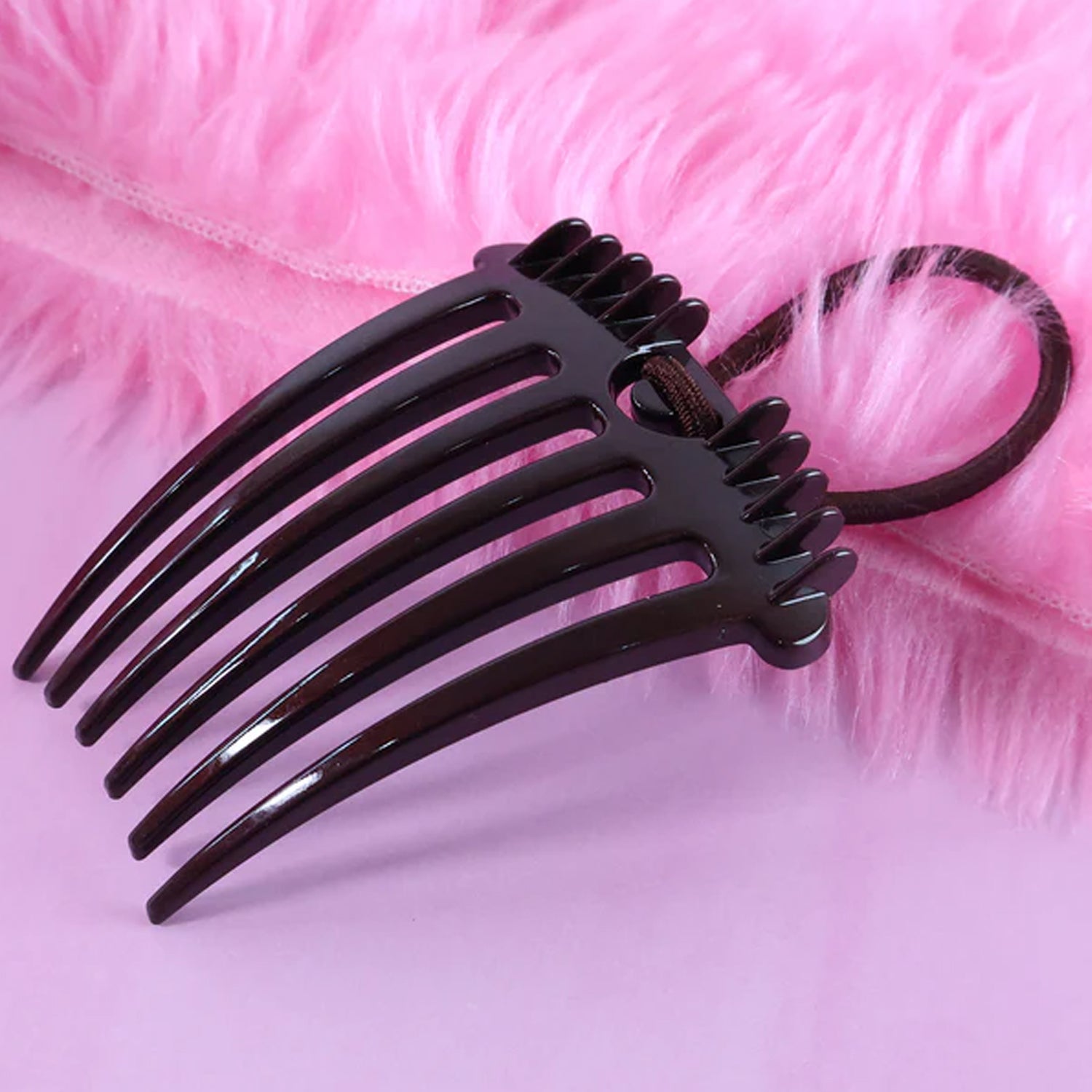 Volumizing hair comb clip used for enhancing hair volume and buns