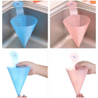 Silicone hanging trash strainer attached inside kitchen sink corner