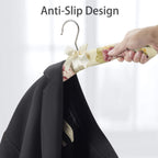 Elegant wardrobe hanger featuring floral pattern and cushioned padding