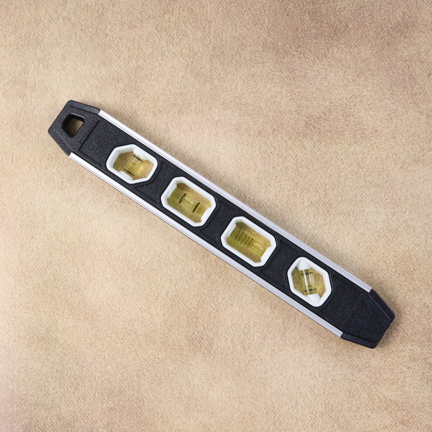 Spirit level tool with hanging hole for easy storage in workshop or toolbox