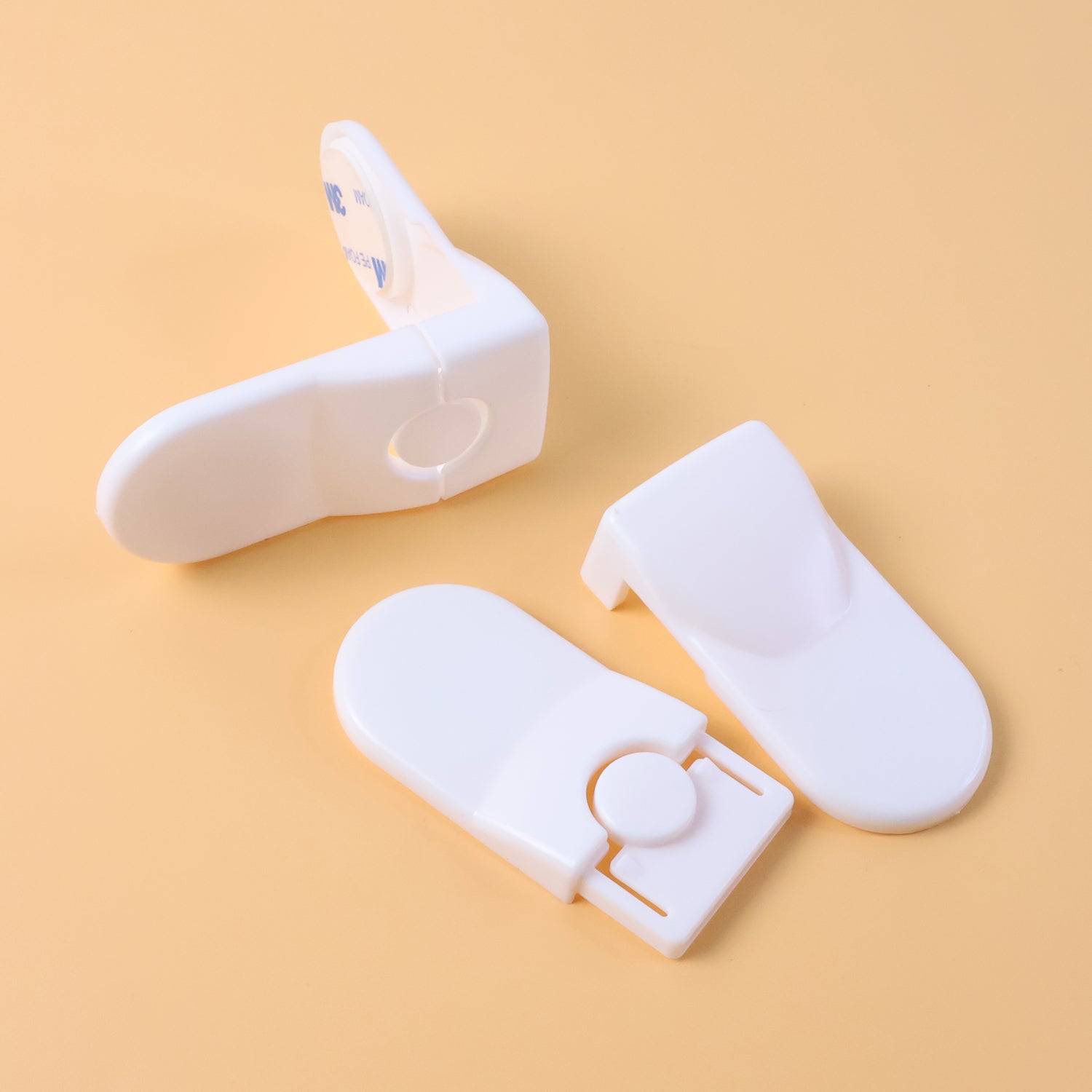 Set of two baby safety locks installed on drawers to childproof