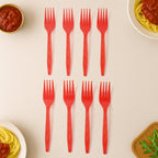 Set of red plastic forks ready for catering event use