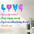 Pair of white love shape self adhesive hooks for easy installation.