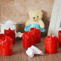 A set of 24 multicolor flameless LED candles with a melted wax design, glowing warmly.