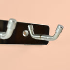 Wall mounted stainless steel coat hook rack showing smooth rounded edges