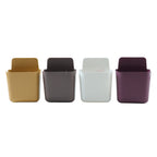 Mixed-colour plastic holders neatly mounted on a wall in an office setting.