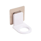 Self-adhesive hook securely holding shampoo and body wash bottles in a shower.