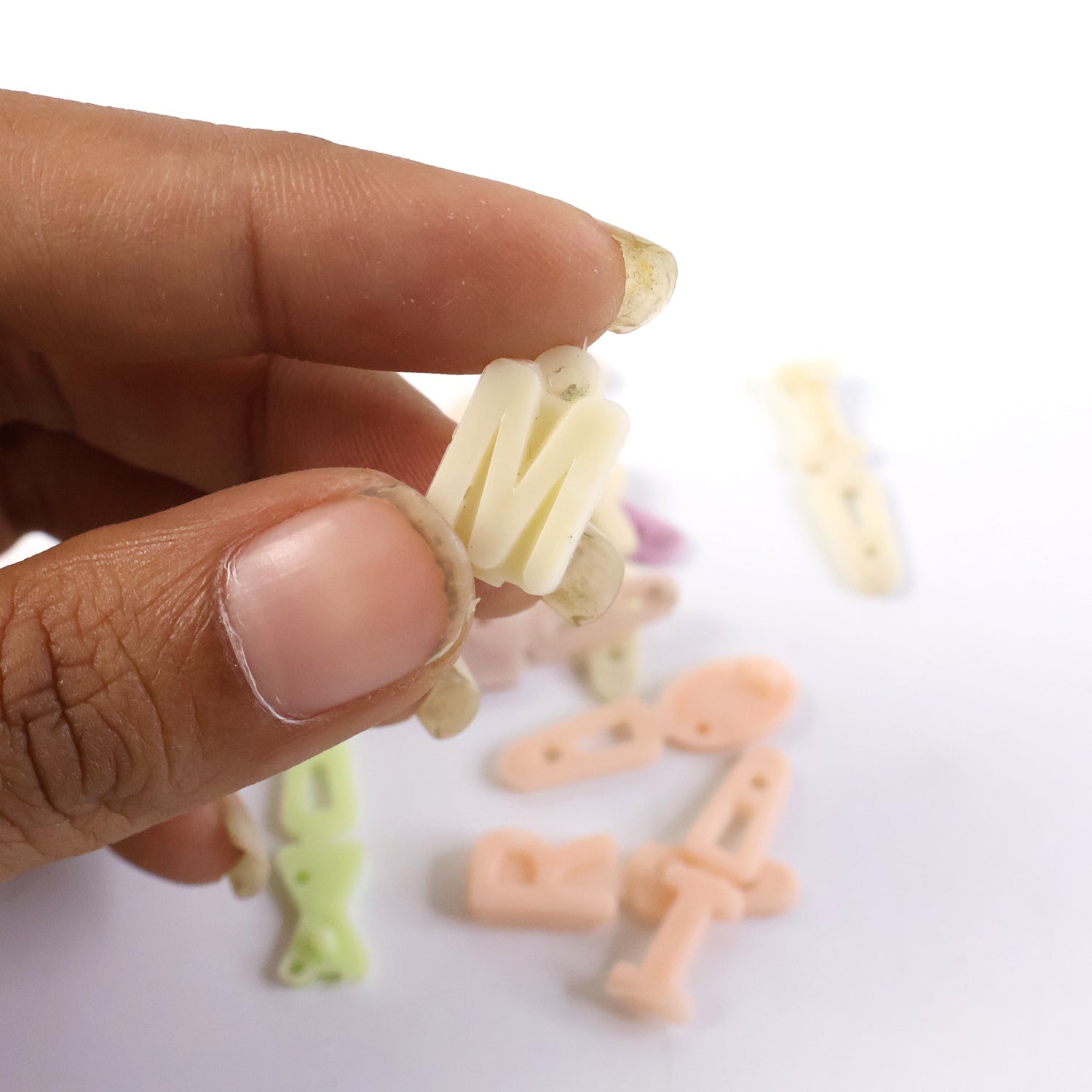 Various colorful individual alphabet beads for craft and jewelry making.