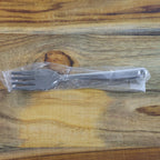 Shiny polished stainless steel dining forks, highlighting their sleek mirror finish.