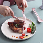 The eco-friendly reusable spoon, fork, and knife set ready for an outdoor picnic setting.