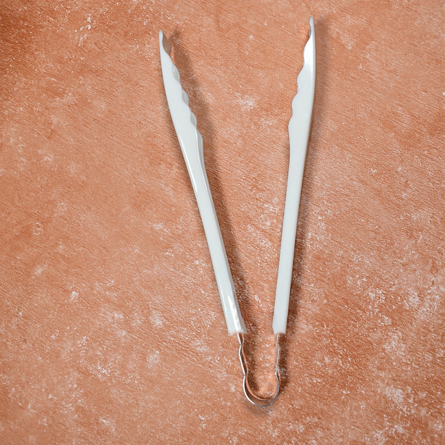 Cooking tongs featuring comfortable plastic handles for prolonged use.