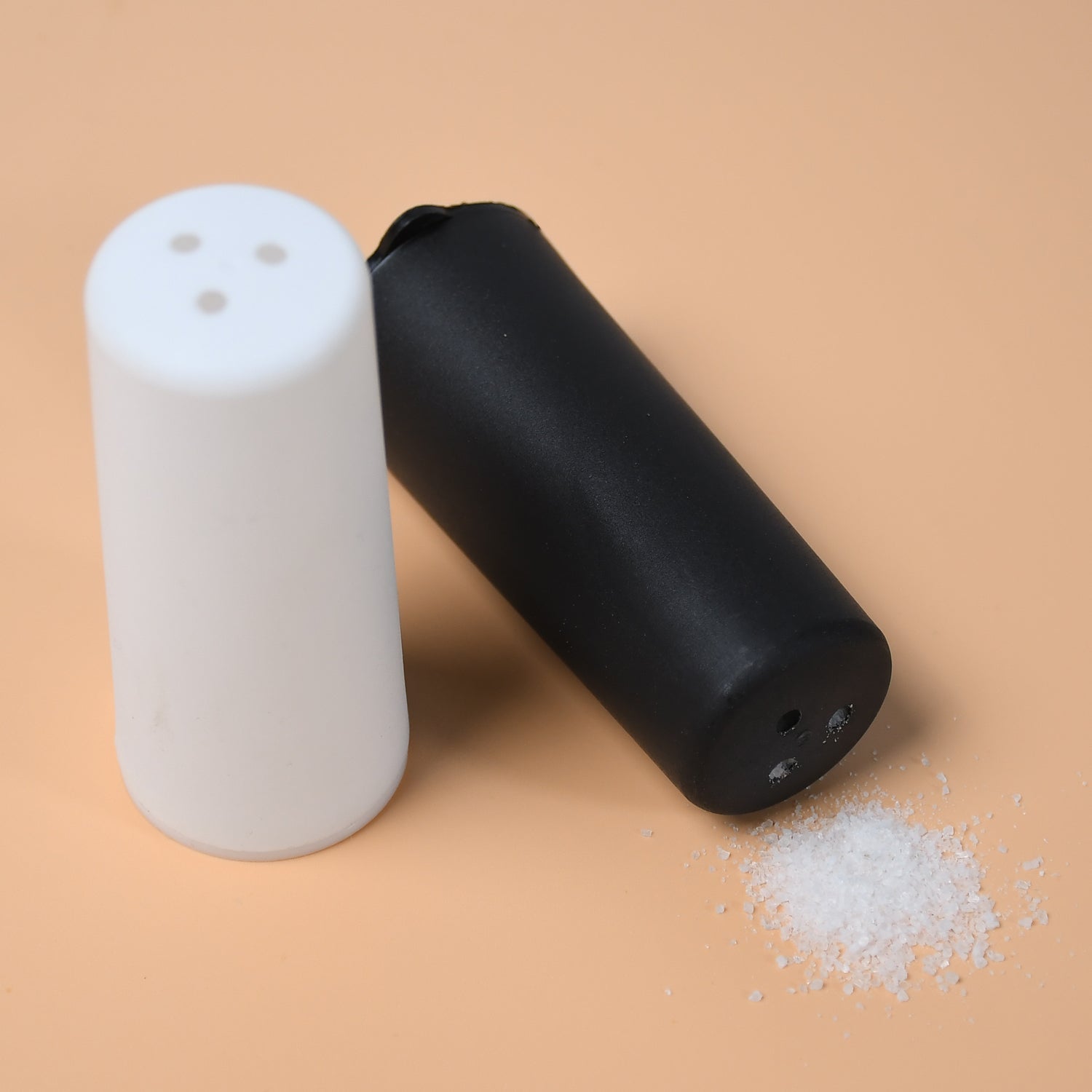 Polycarbonate spice dispensers with a clean, minimalist design.