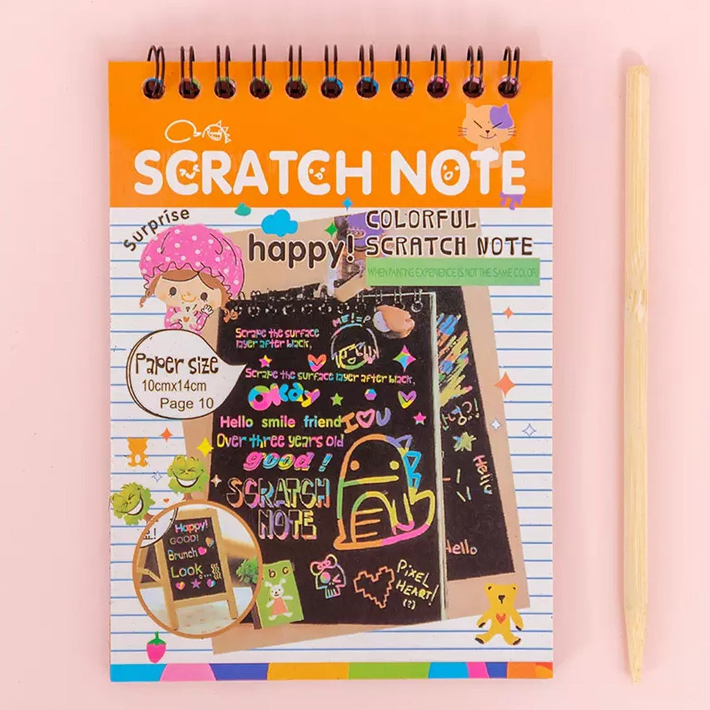 A child's hand scratching a rainbow art scratch book, revealing vibrant colours.