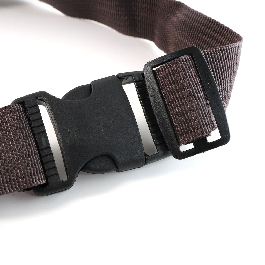 Brown canvas waist bag showing detailed zipper and leather accents