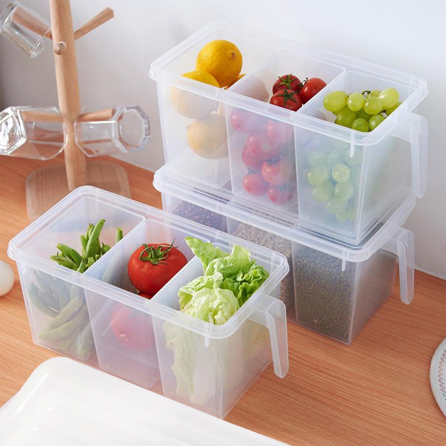 Transparent refrigerator organizer box with three compartments.