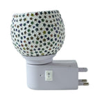 Warm glowing star pattern mosaic glass night lamp creating cozy ambience