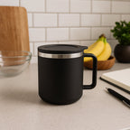 Top-down view of the black insulated coffee mug with its secure silicone lid.
