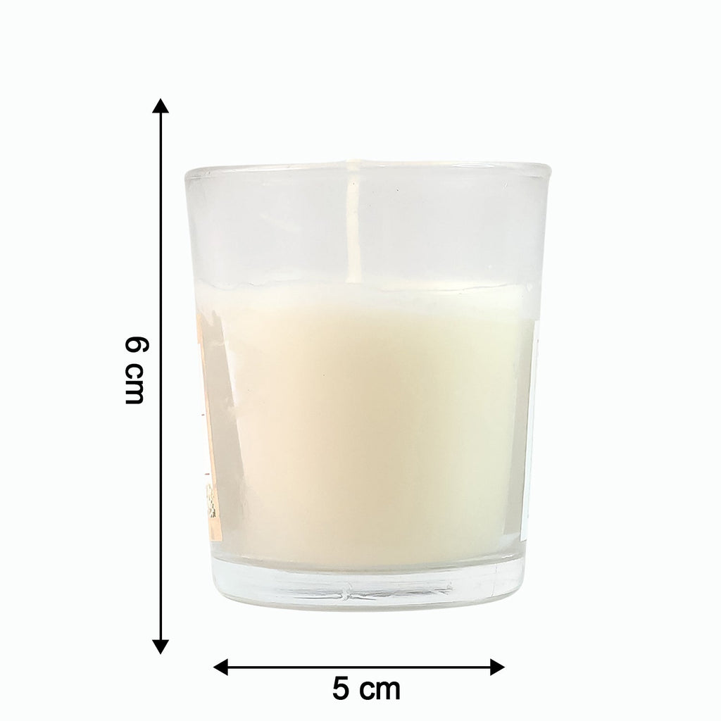 Close-up of a lit Blueberry Scented Votive Candle, showing the gentle flame.