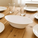Stacked white Marin oval serving bowls for compact kitchen storage