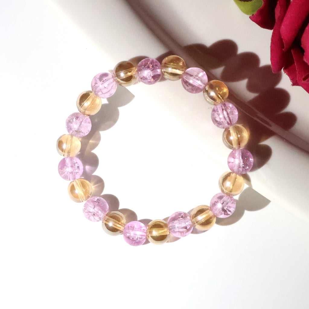 Close-up image of transparent crystal beads on dual-tone stretch bracelet